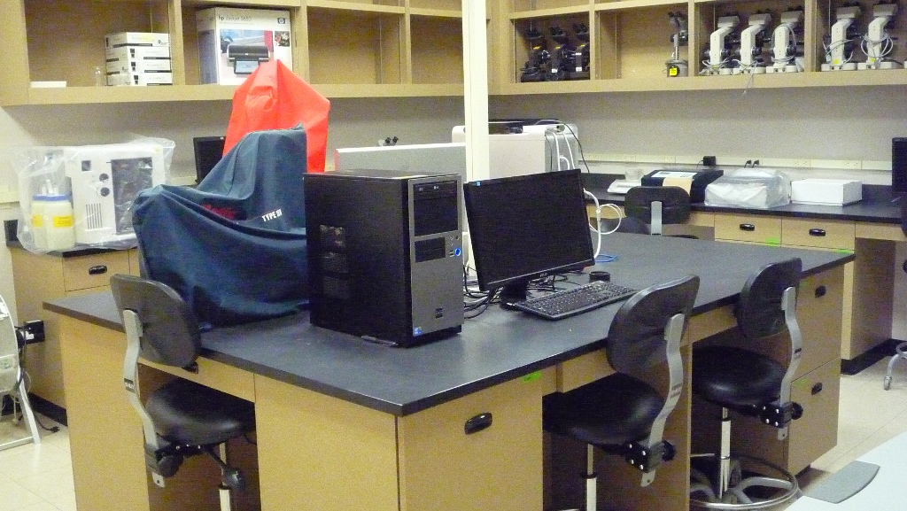 room with computers and microscopes